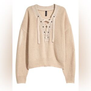 Divided beige colored lace up sweater size extra small